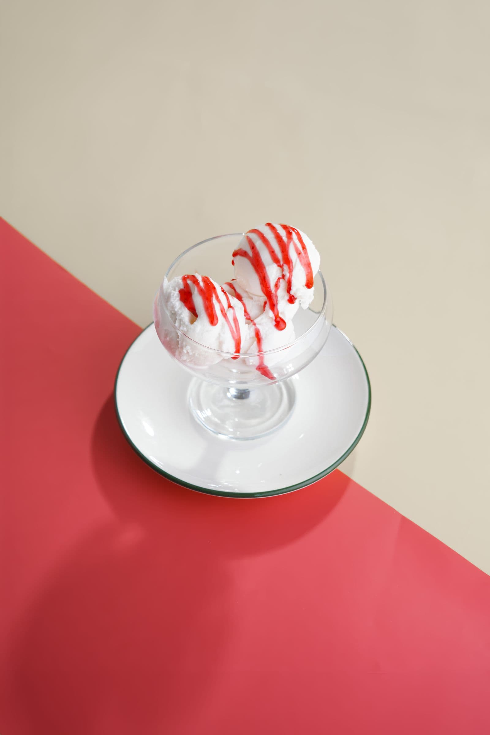 Ice cream sundae with fruit sauce